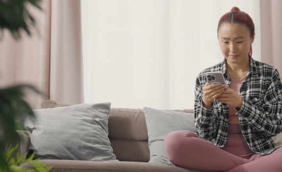 Woman looking to GLS parcelshop map