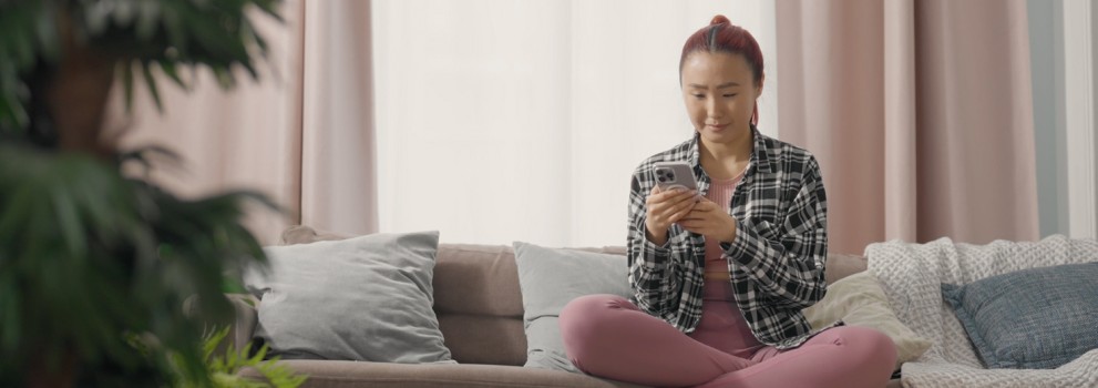 Woman looking to GLS parcelshop map