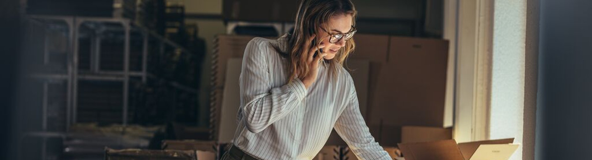 women using phone to call hotline